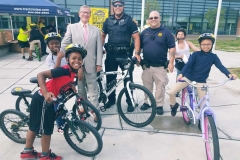 Chick Pritchard, Director of Communications at Trantolo & Trantolo, Bridgeport Police Officers and local Bridgeport youth.