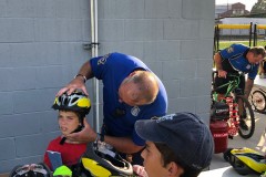 Bike helmet fitting at Waterbury PAL