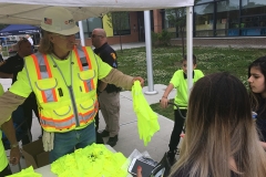 Handing out Heads Up For Safety t-shirts.